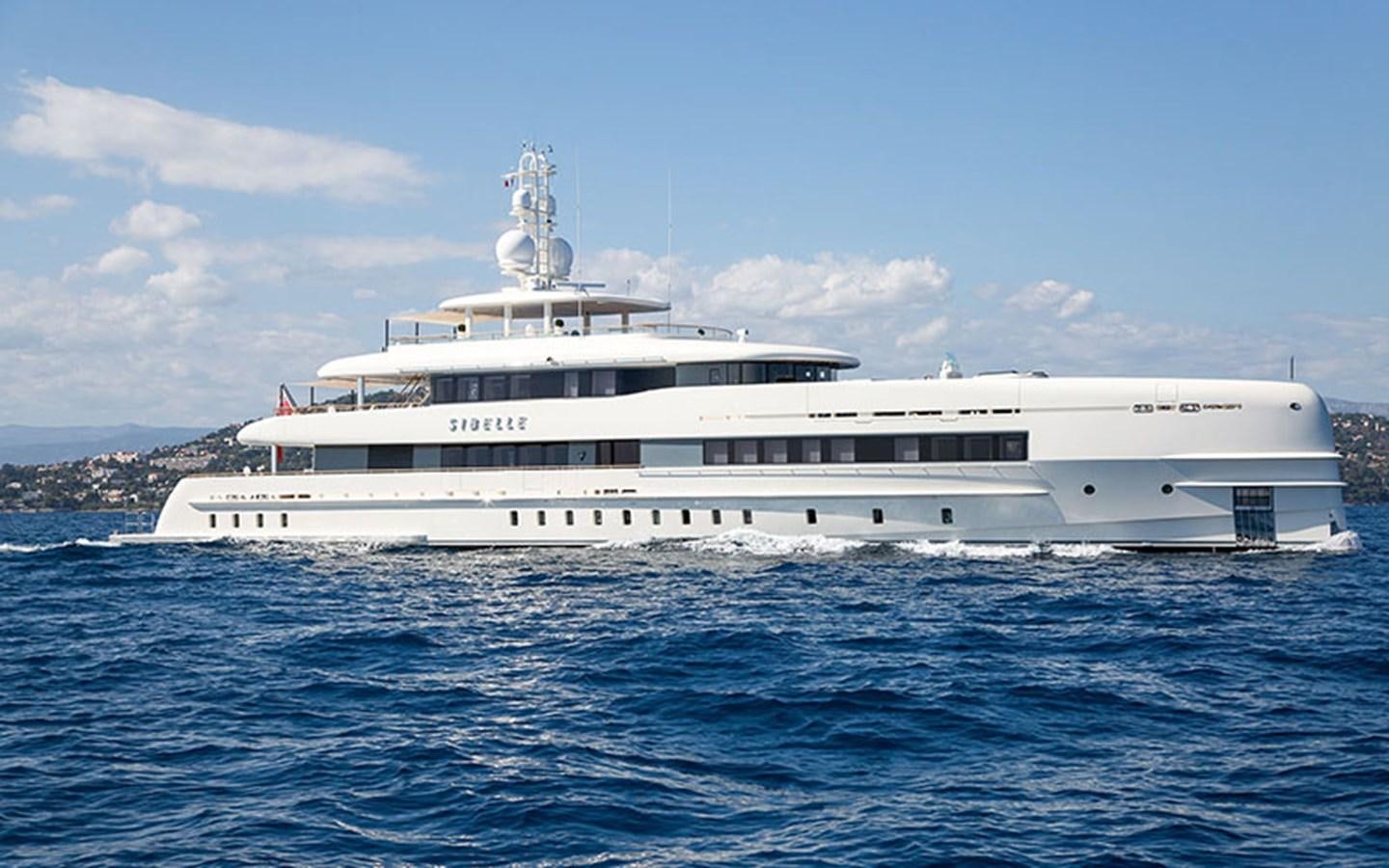 a large white ship in the water aboard BIJIN Yacht for Sale
