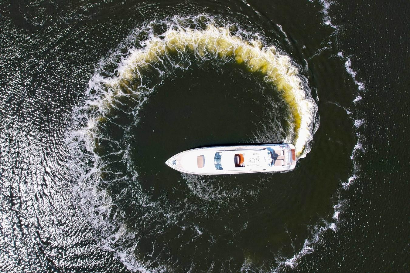 a person in a boat aboard 108' MANGUSTA 2002 Yacht for Sale