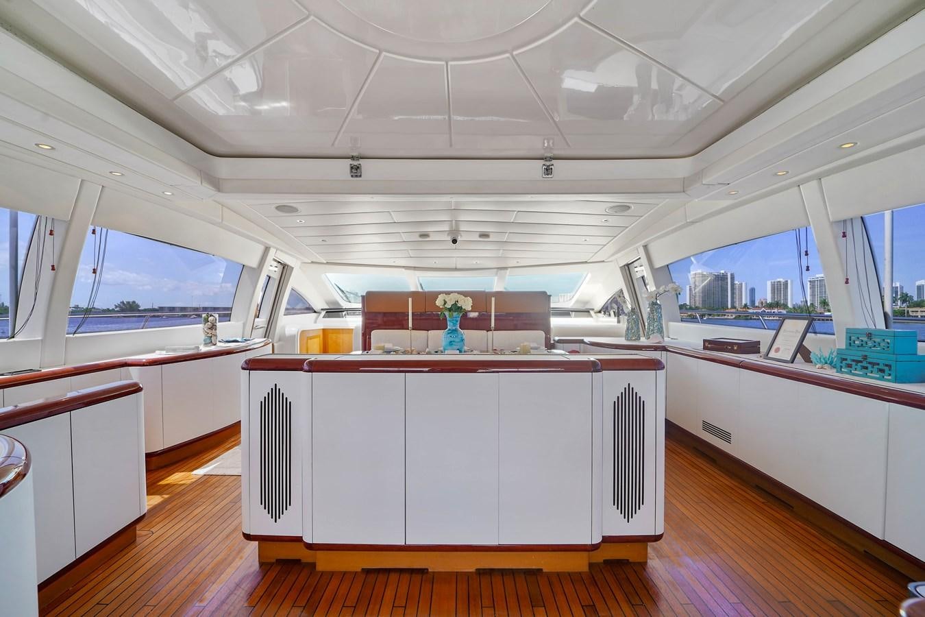 a room with a desk and a window aboard 108' MANGUSTA 2002 Yacht for Sale