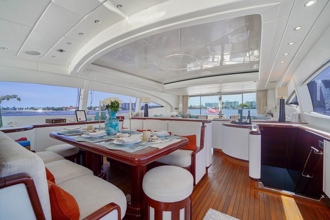 a room with a table and chairs aboard 108' MANGUSTA 2002 Yacht for Sale