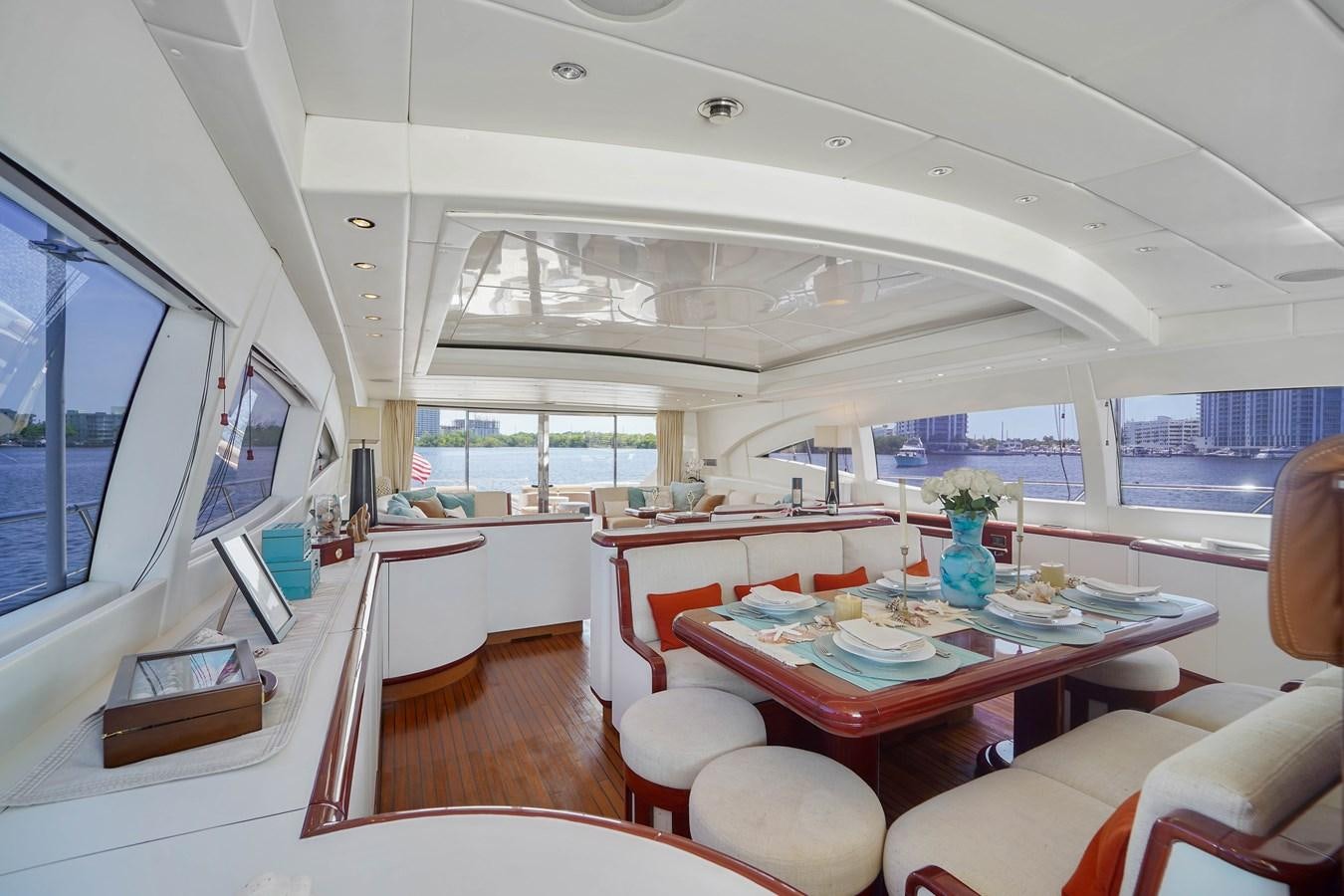 a room with a table and chairs aboard 108' MANGUSTA 2002 Yacht for Sale