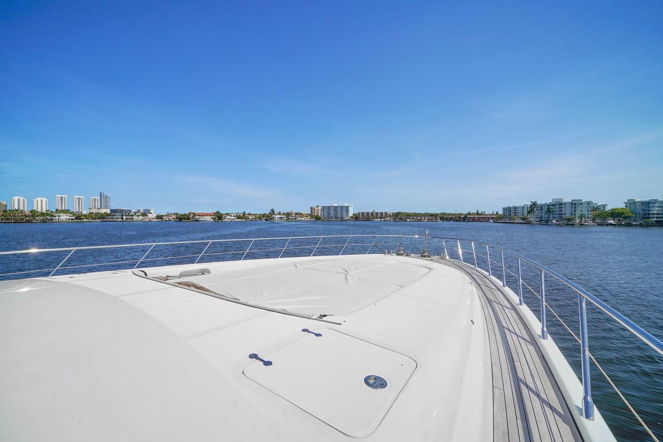 a large white boat on a body of water aboard 108' MANGUSTA 2002 Yacht for Sale