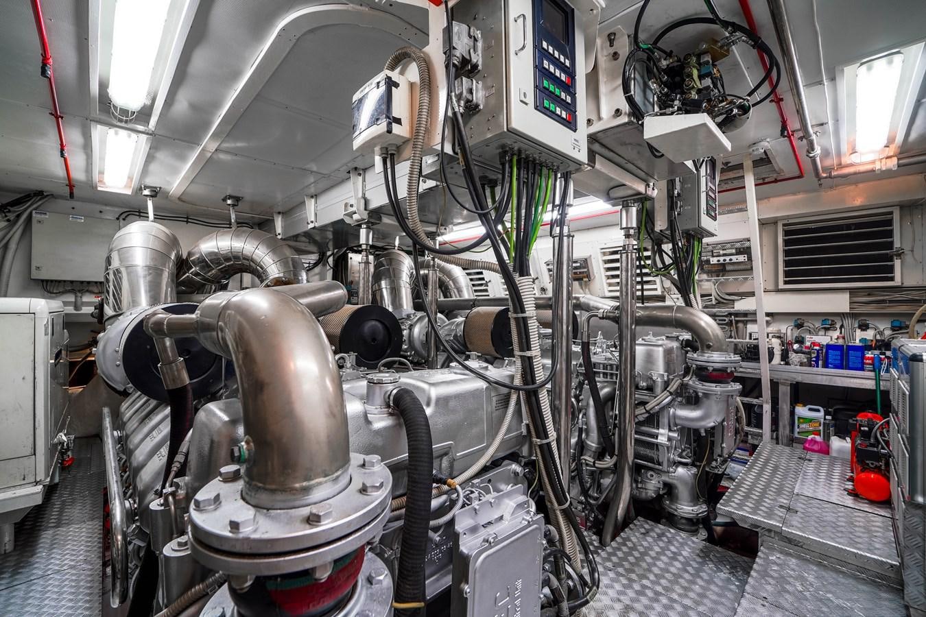 a machine in a room aboard 108' MANGUSTA 2002 Yacht for Sale