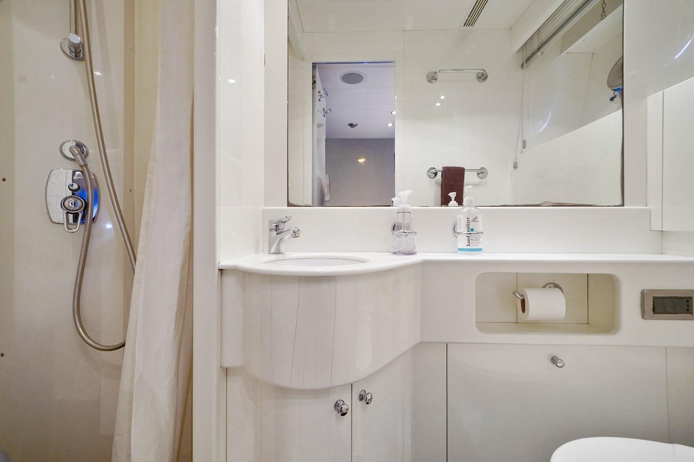 a bathroom with a shower and a sink aboard 108' MANGUSTA 2002 Yacht for Sale