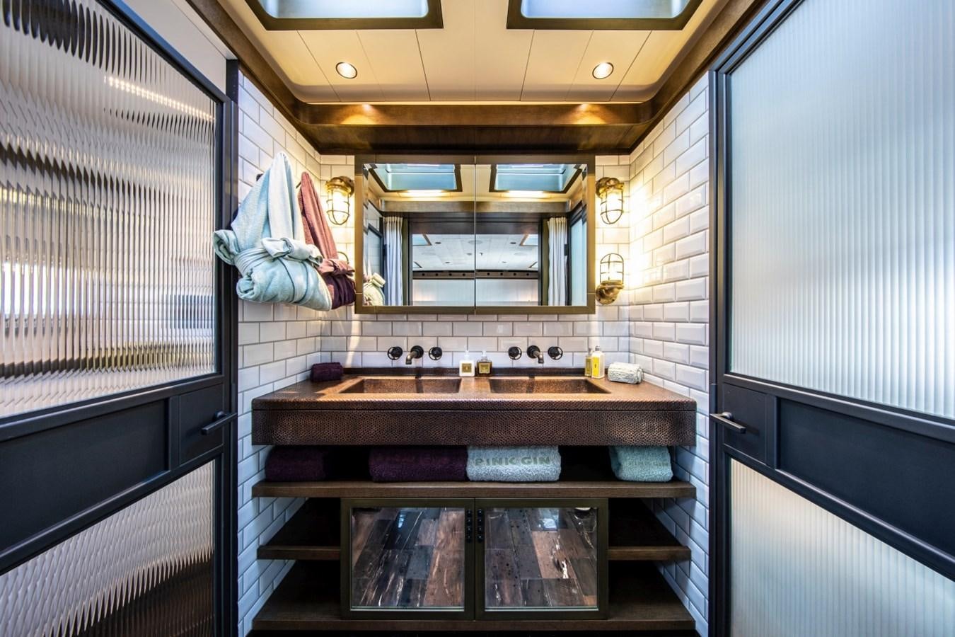 a bathroom with a sink and a mirror aboard PINK GIN Yacht for Sale