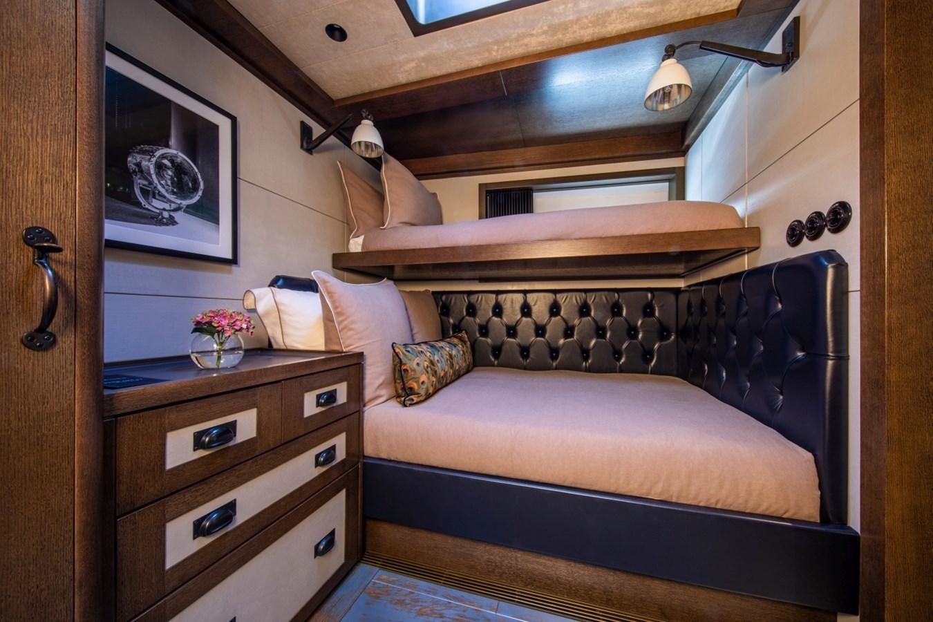 a bed with a pink couch aboard PINK GIN Yacht for Sale