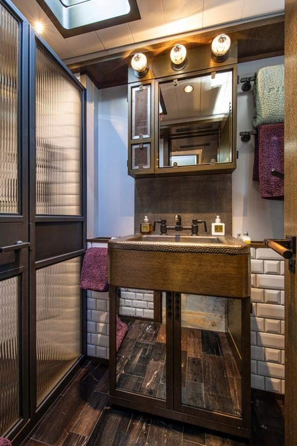 a bathroom with a large mirror aboard PINK GIN Yacht for Sale