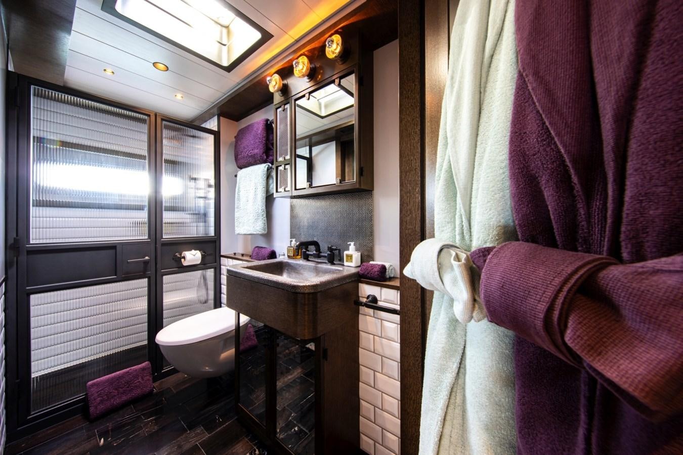 a bathroom with a sink and a toilet aboard PINK GIN Yacht for Sale