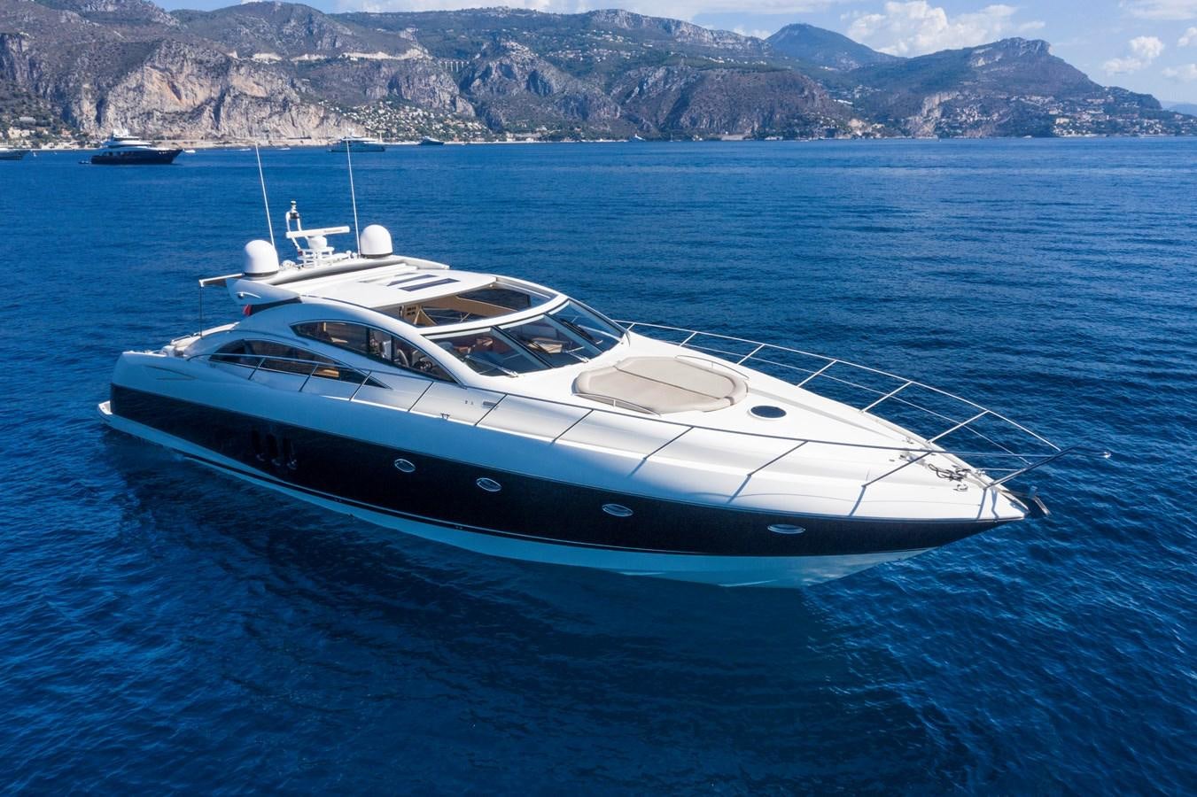 a white yacht in the water aboard NUTS Yacht for Sale