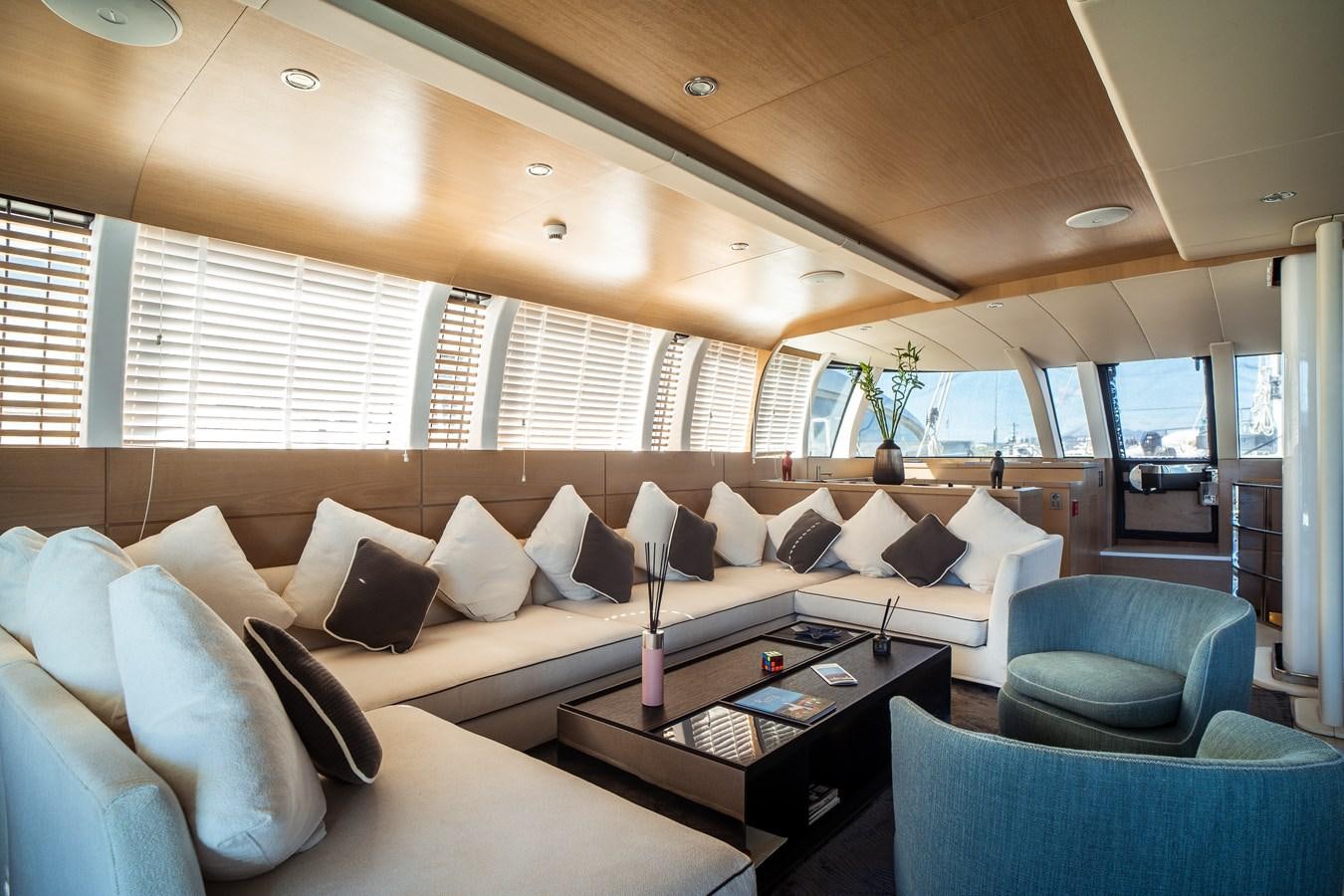a living room with a couch and a coffee table aboard ONE FORCE Yacht for Sale