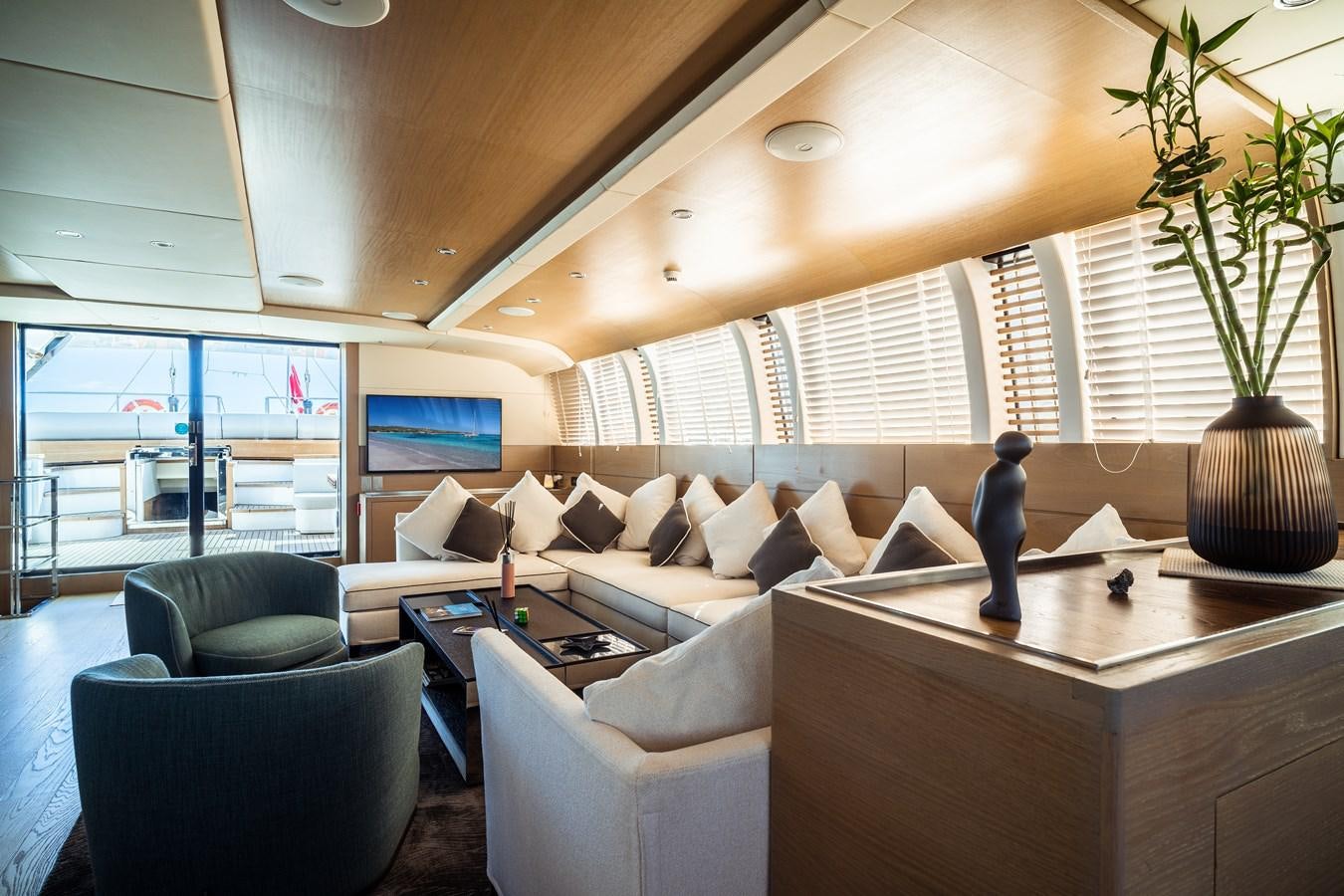 a living room with a large window aboard ONE FORCE Yacht for Sale