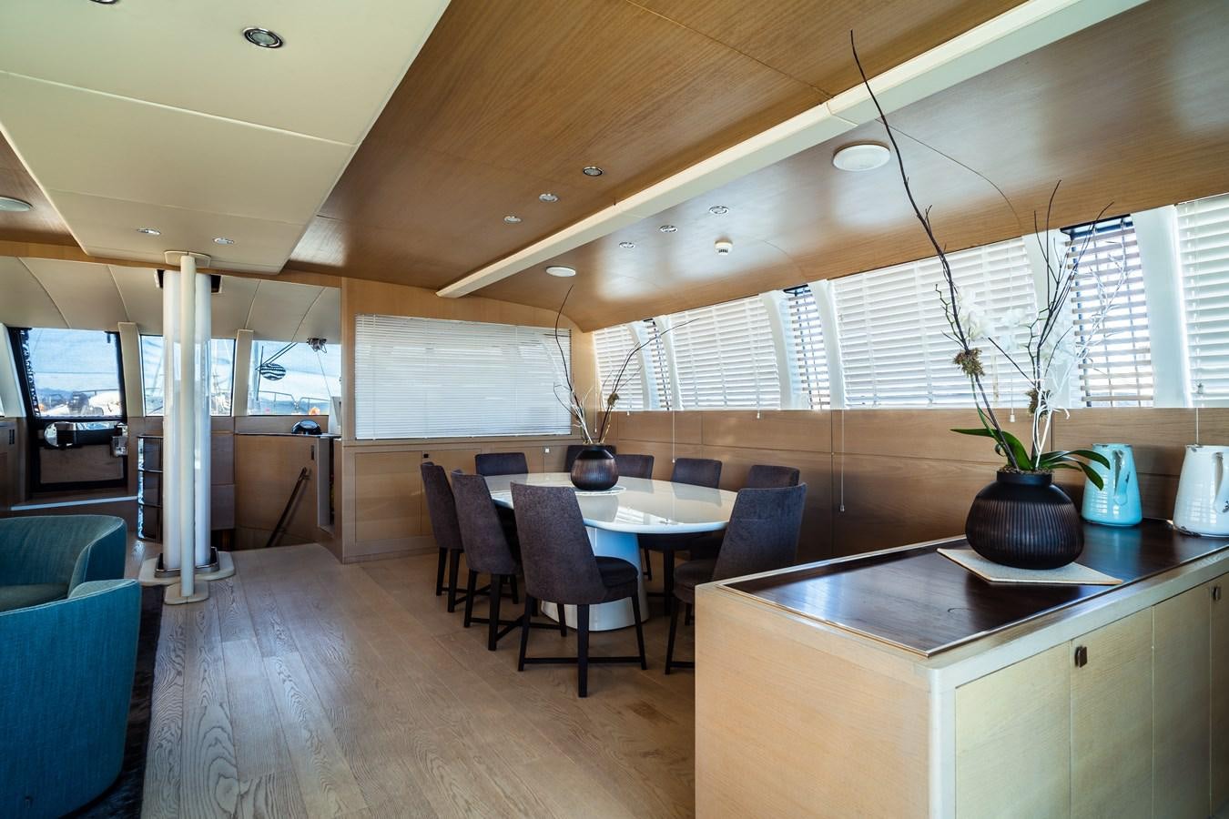 a room with a table and chairs aboard ONE FORCE Yacht for Sale