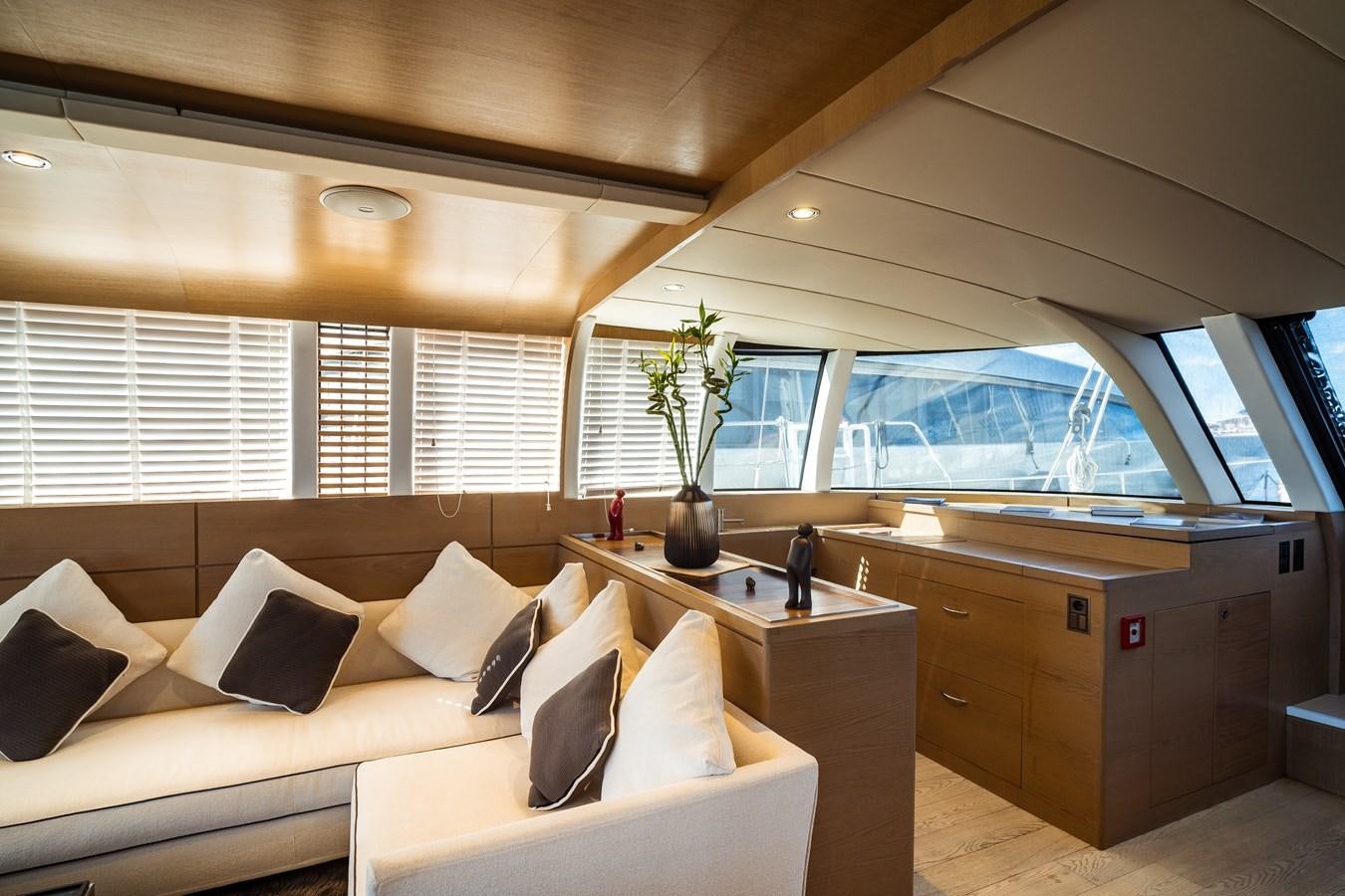 a room with a couch and a desk aboard ONE FORCE Yacht for Sale