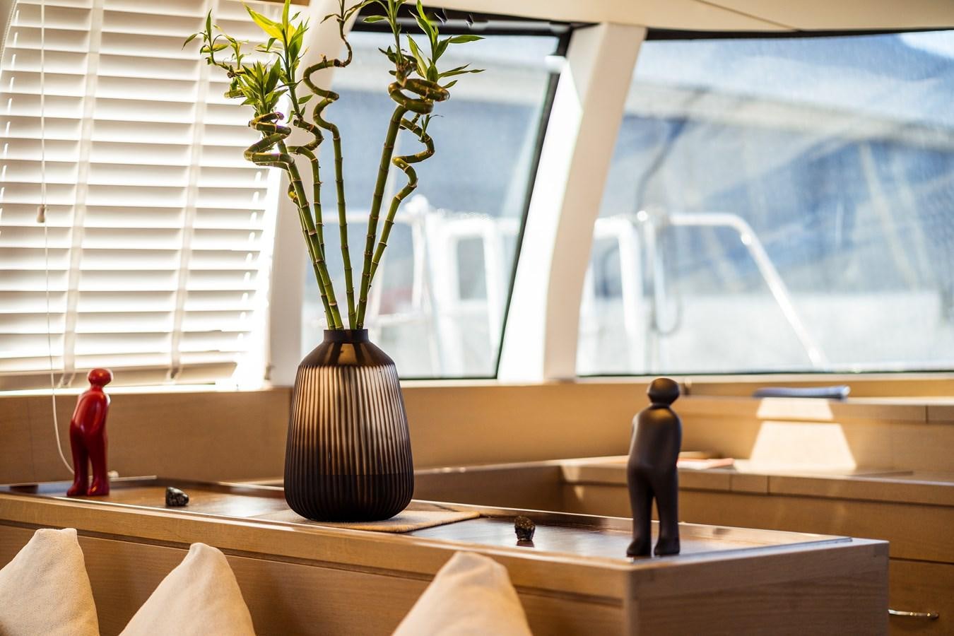 a vase with flowers on a counter aboard ONE FORCE Yacht for Sale