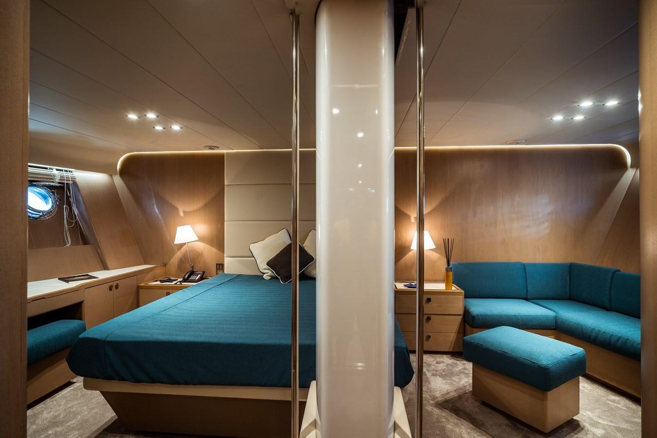 a room with a bed and a desk aboard ONE FORCE Yacht for Sale