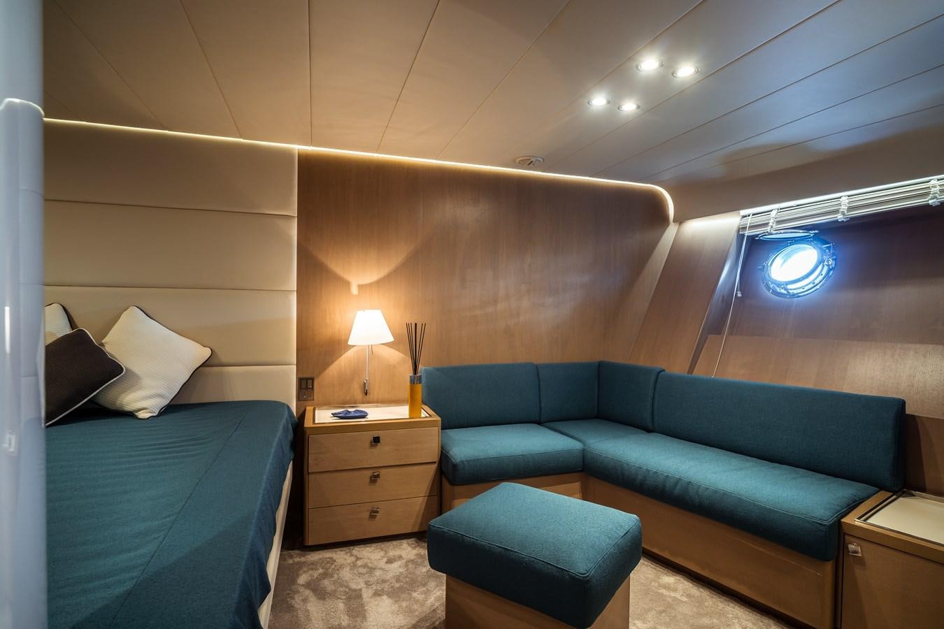 a room with a bed and a couch aboard ONE FORCE Yacht for Sale