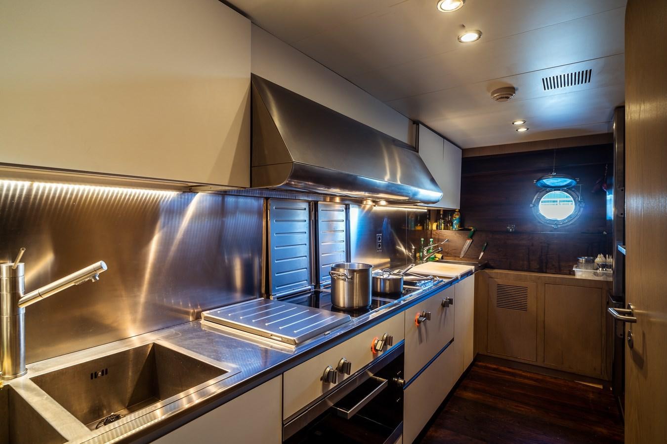a kitchen with stainless steel appliances aboard ONE FORCE Yacht for Sale