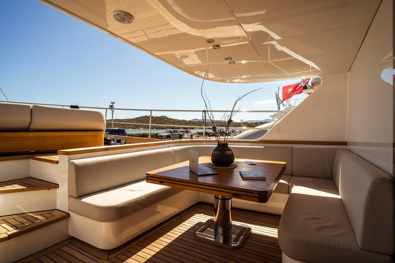 a room with a couch and a table aboard ONE FORCE Yacht for Sale