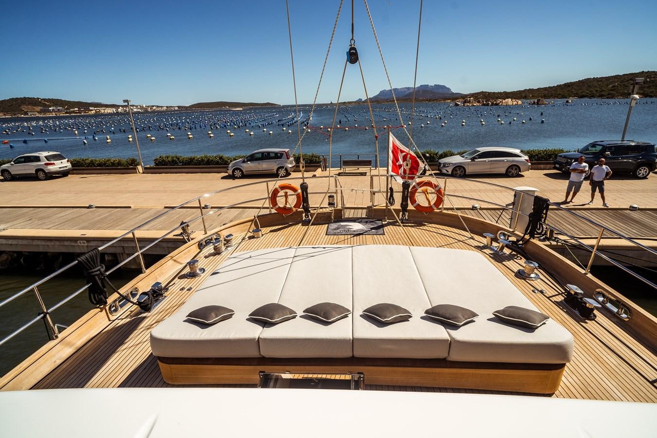 a white car parked on a road aboard ONE FORCE Yacht for Sale