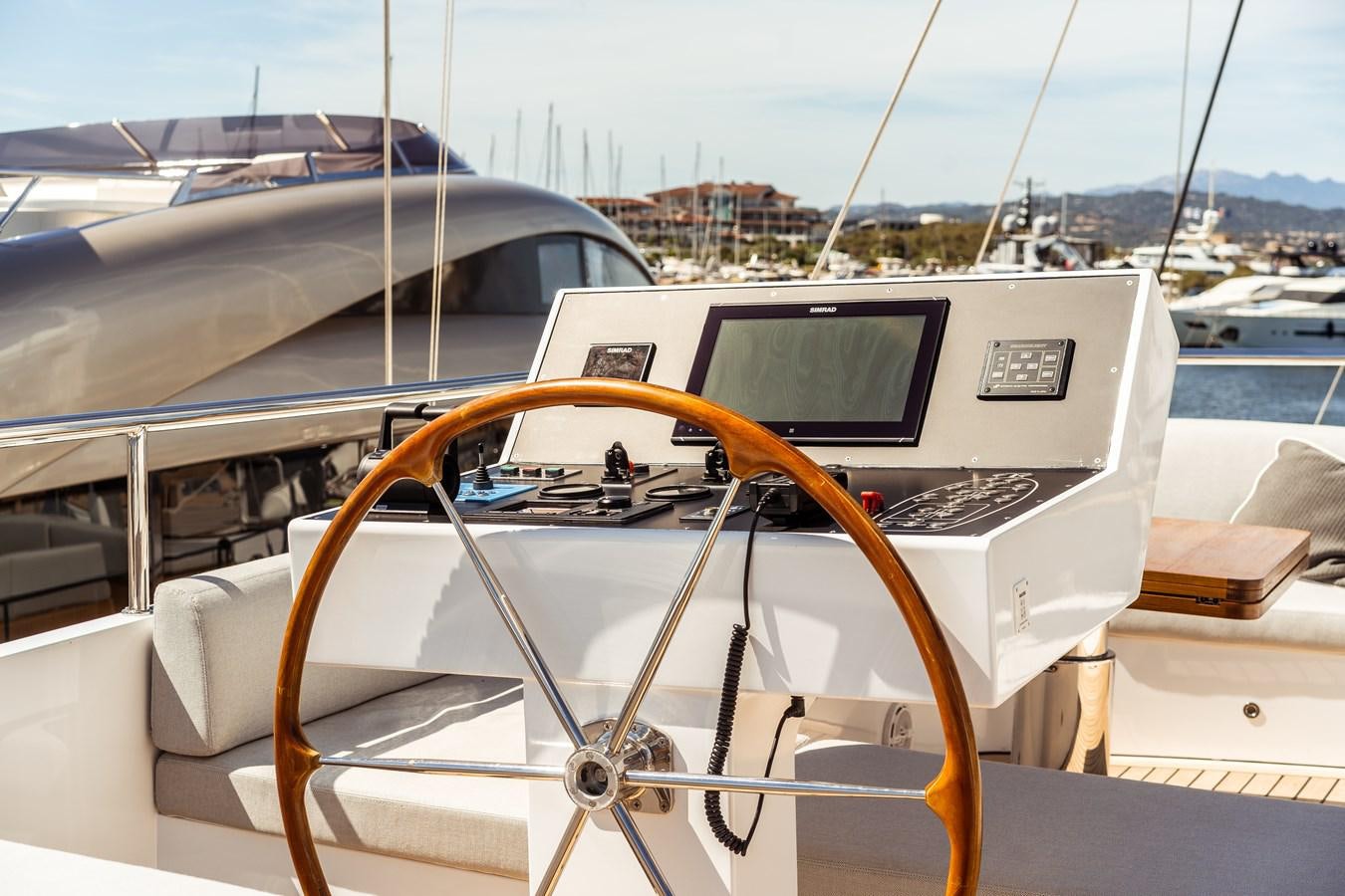 a steering wheel on a boat aboard ONE FORCE Yacht for Sale