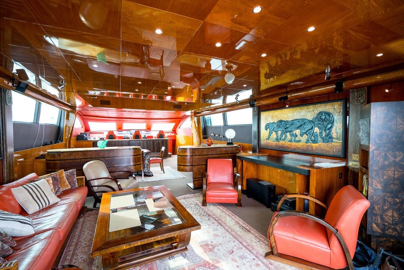 a large room with a table and chairs aboard CHASING SPIRIT Yacht for Sale
