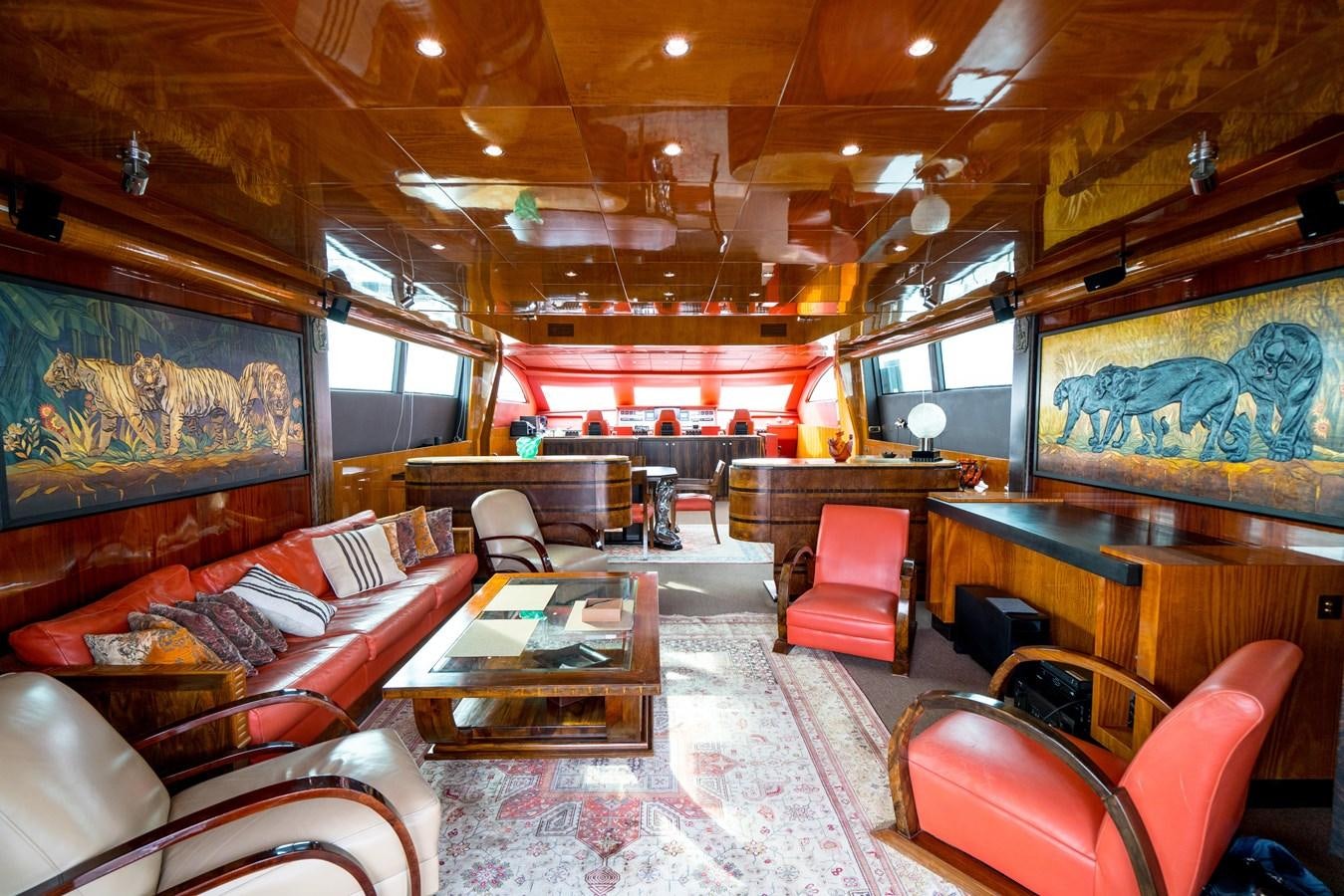 a large room with a large table and chairs aboard CHASING SPIRIT Yacht for Sale