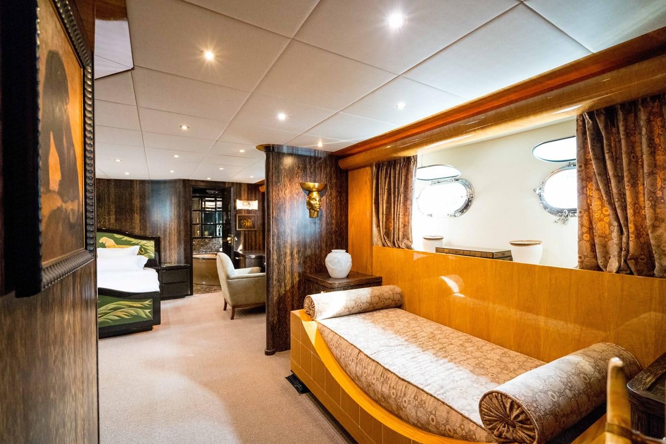 a room with a bed and a couch aboard CHASING SPIRIT Yacht for Sale