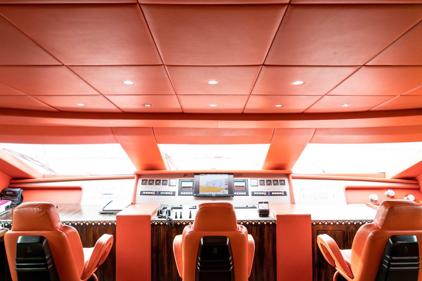 a room with chairs and a table aboard CHASING SPIRIT Yacht for Sale