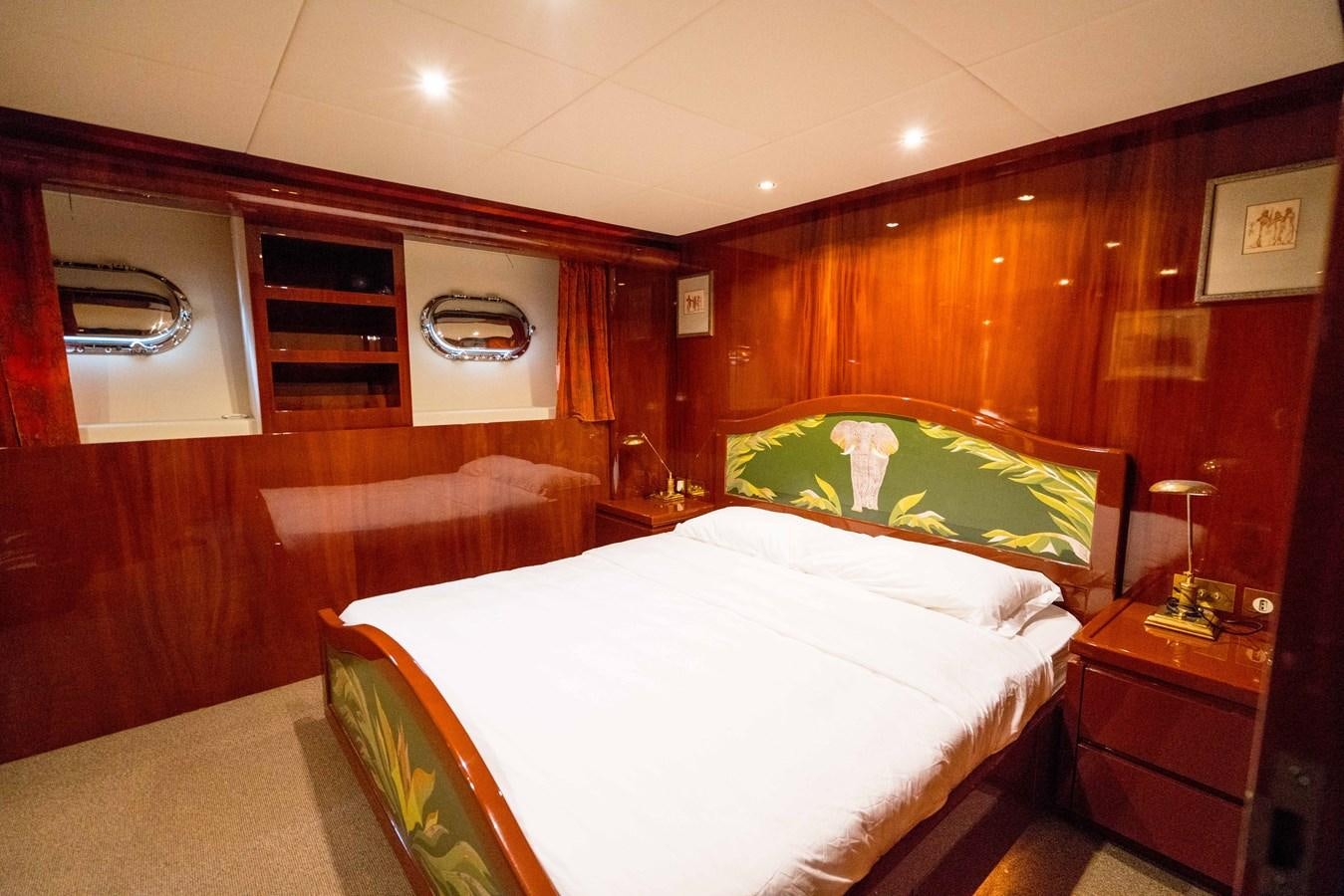 a room with a bed and a couch aboard CHASING SPIRIT Yacht for Sale