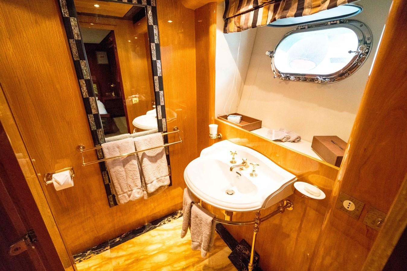 a bathroom with a large mirror aboard CHASING SPIRIT Yacht for Sale