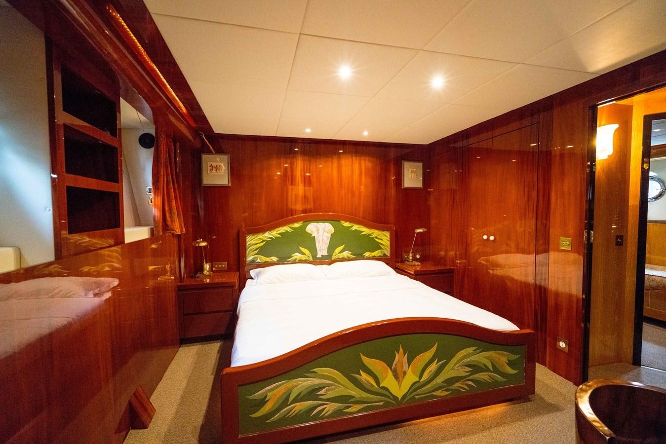 a room with a couple of beds aboard CHASING SPIRIT Yacht for Sale