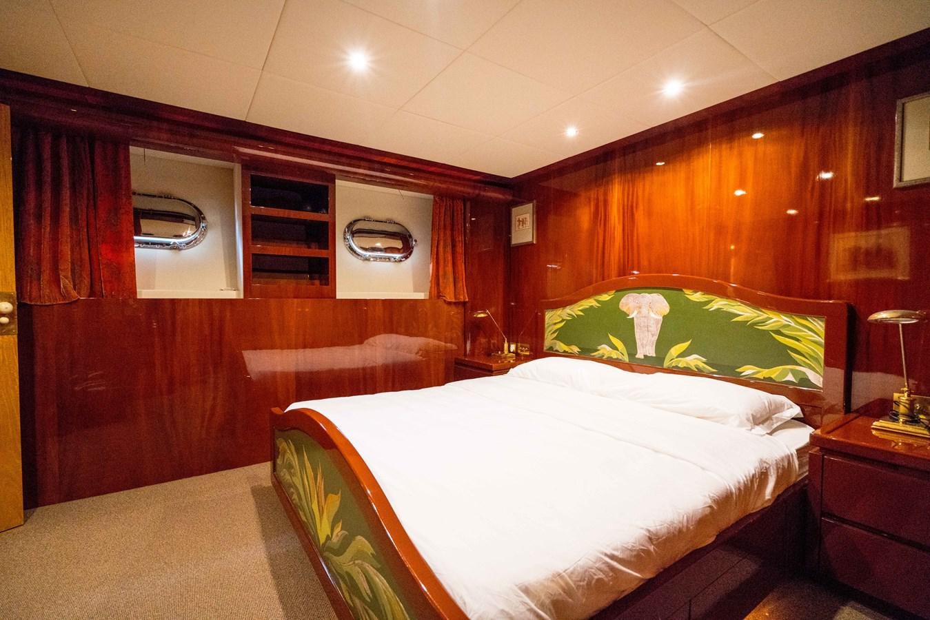 a room with a bed and a television aboard CHASING SPIRIT Yacht for Sale