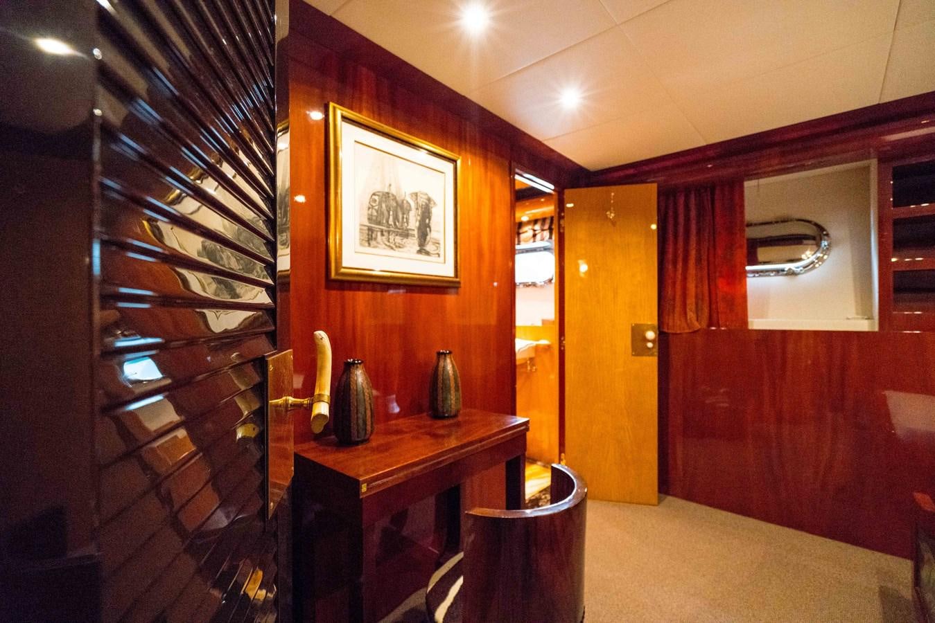 a room with a desk and a mirror aboard CHASING SPIRIT Yacht for Sale