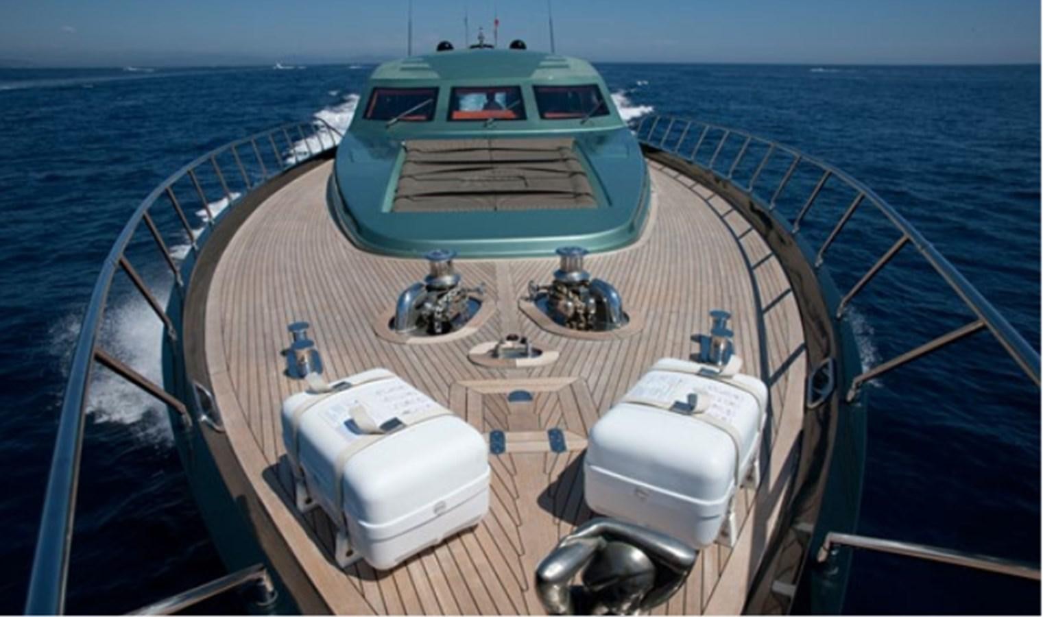 a large ship with a deck and a small boat on it aboard CHASING SPIRIT Yacht for Sale