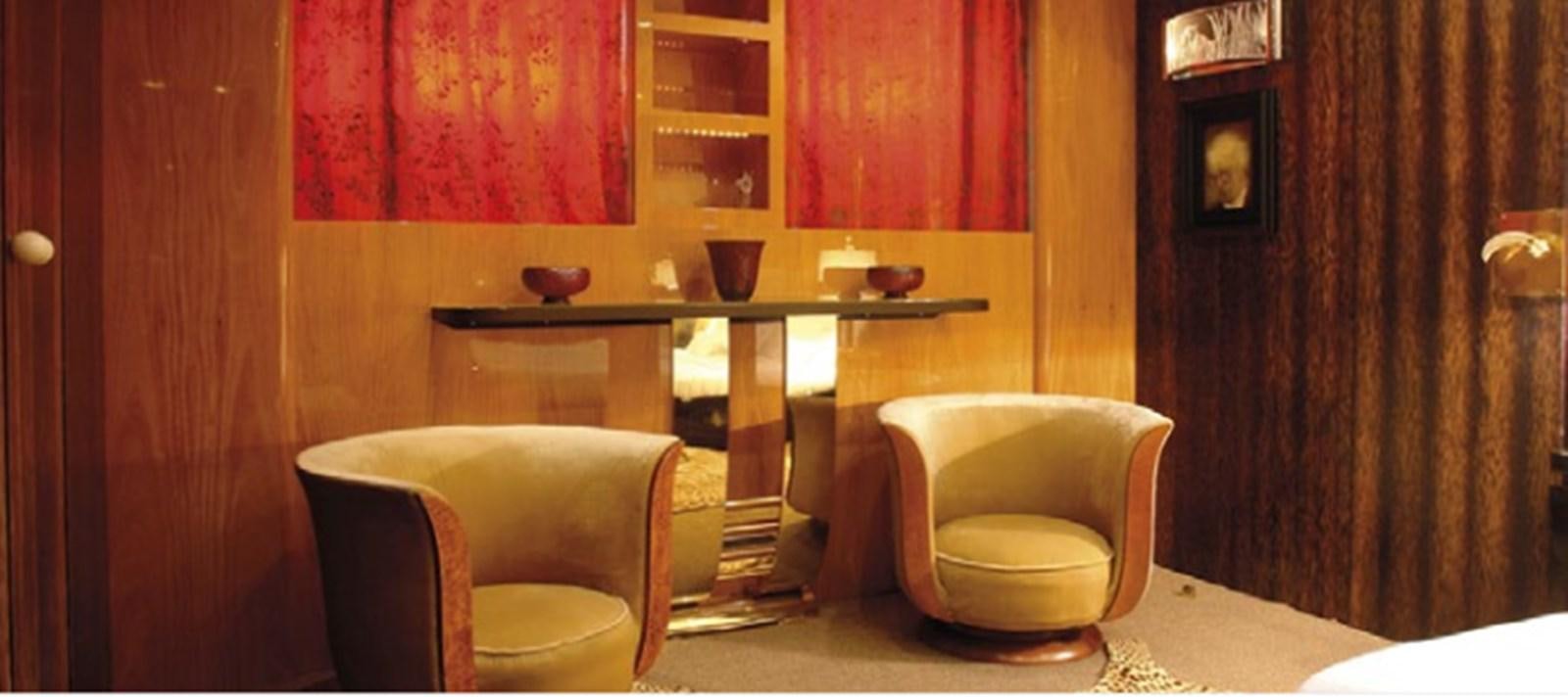 a room with a table and chairs aboard CHASING SPIRIT Yacht for Sale