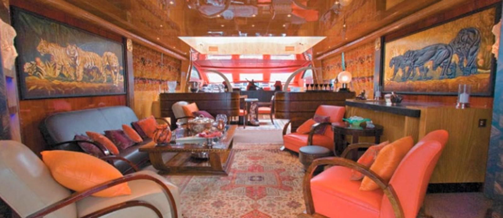a room with a couch and chairs aboard CHASING SPIRIT Yacht for Sale