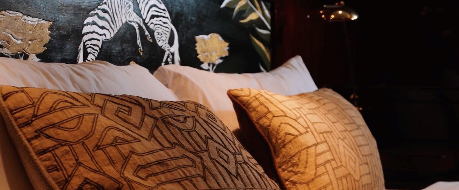 a bed with a flower on it aboard CHASING SPIRIT Yacht for Sale