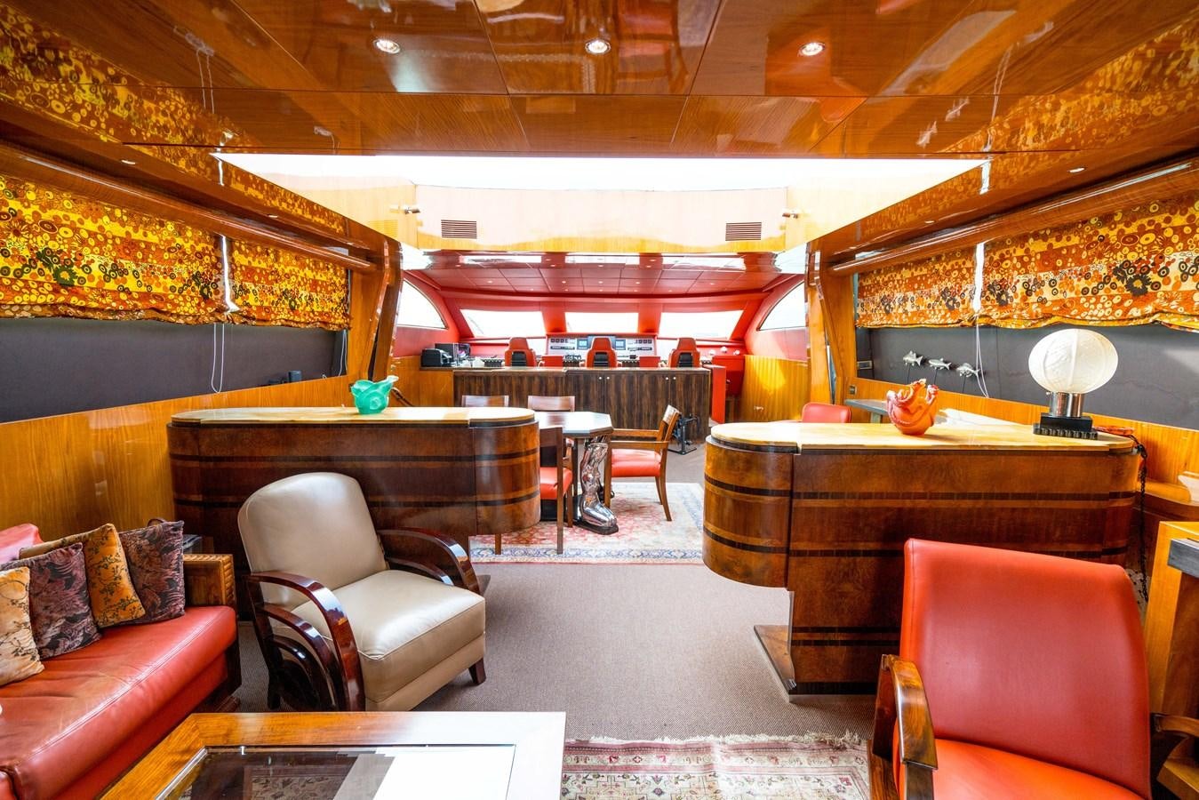 a room with a piano and a couch aboard CHASING SPIRIT Yacht for Sale