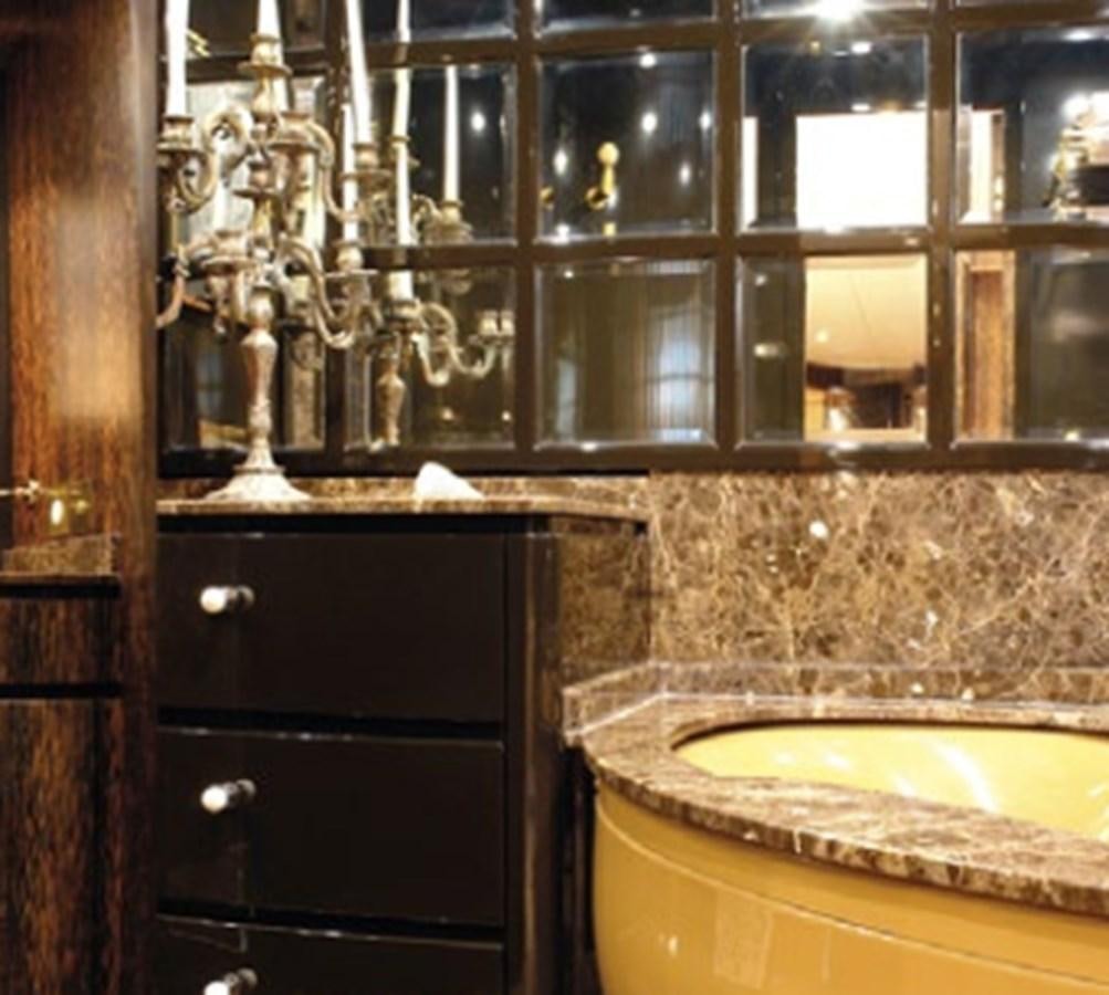 a bathroom with a sink and a mirror aboard CHASING SPIRIT Yacht for Sale