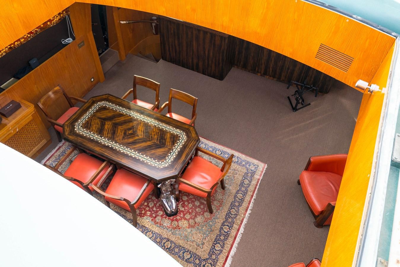 a room with a bed and a chair aboard CHASING SPIRIT Yacht for Sale