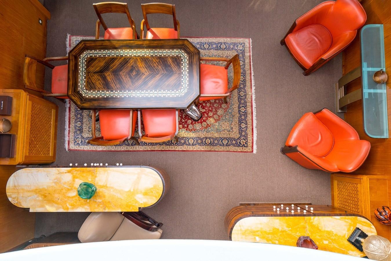 a table with a painting on it aboard CHASING SPIRIT Yacht for Sale