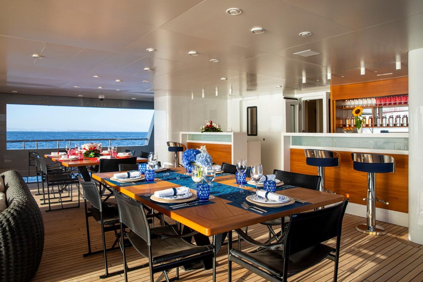 a large dining room with a table and chairs aboard AUDACE Yacht for Sale