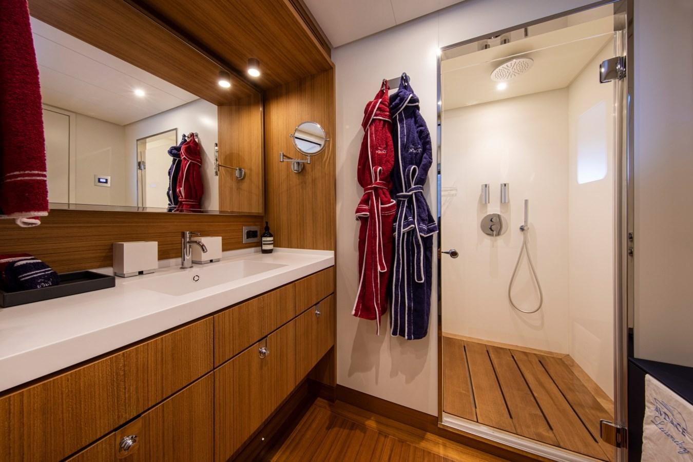 a bathroom with a large mirror aboard AUDACE Yacht for Sale