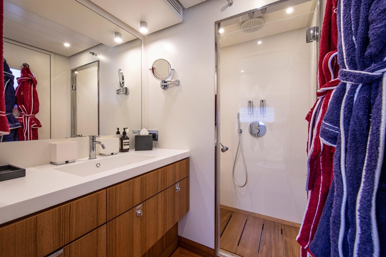 a bathroom with a shower and sink aboard AUDACE Yacht for Sale