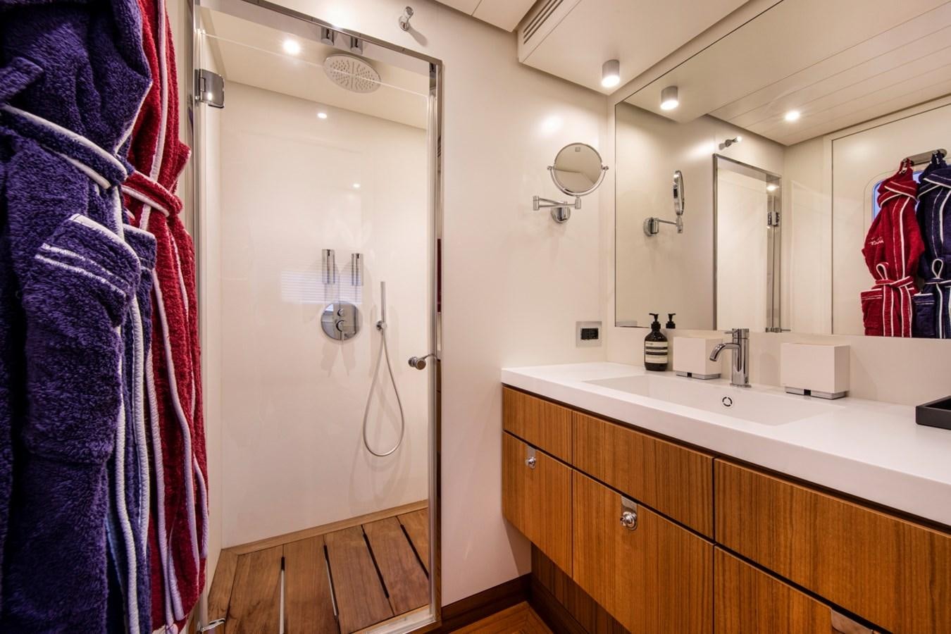 a bathroom with a sink and a mirror aboard AUDACE Yacht for Sale