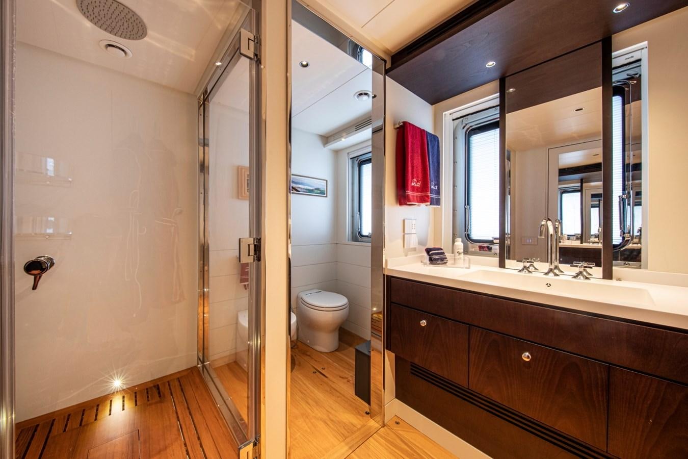 a bathroom with a large mirror aboard AUDACE Yacht for Sale
