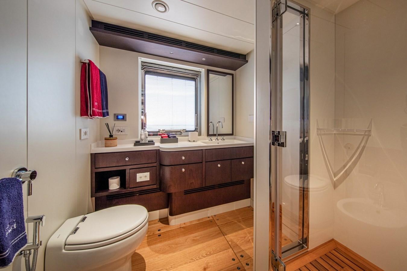a bathroom with a sink toilet and a shower aboard AUDACE Yacht for Sale