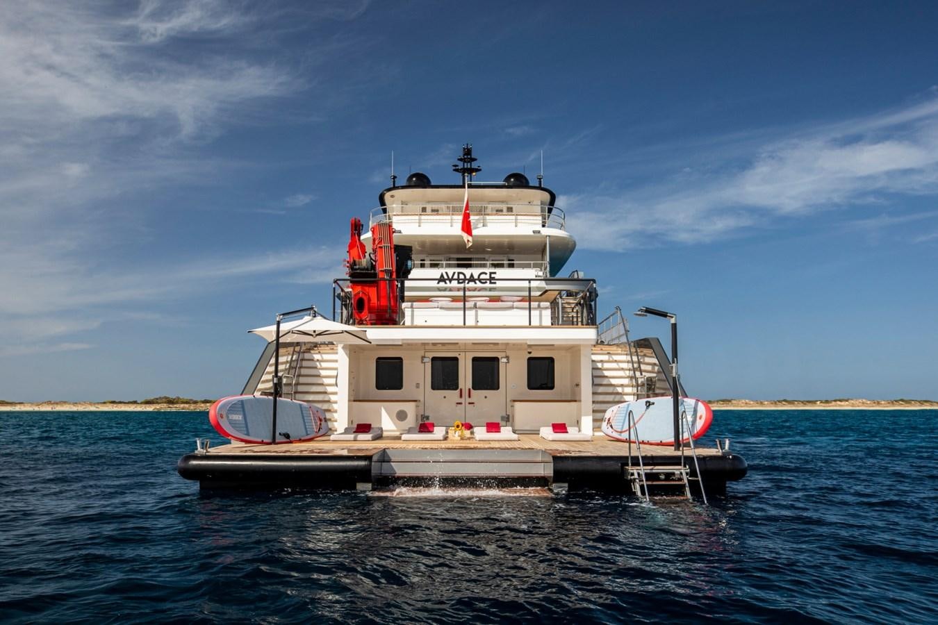 a boat on the water with Thomas Point Shoal Light in the background aboard AUDACE Yacht for Sale