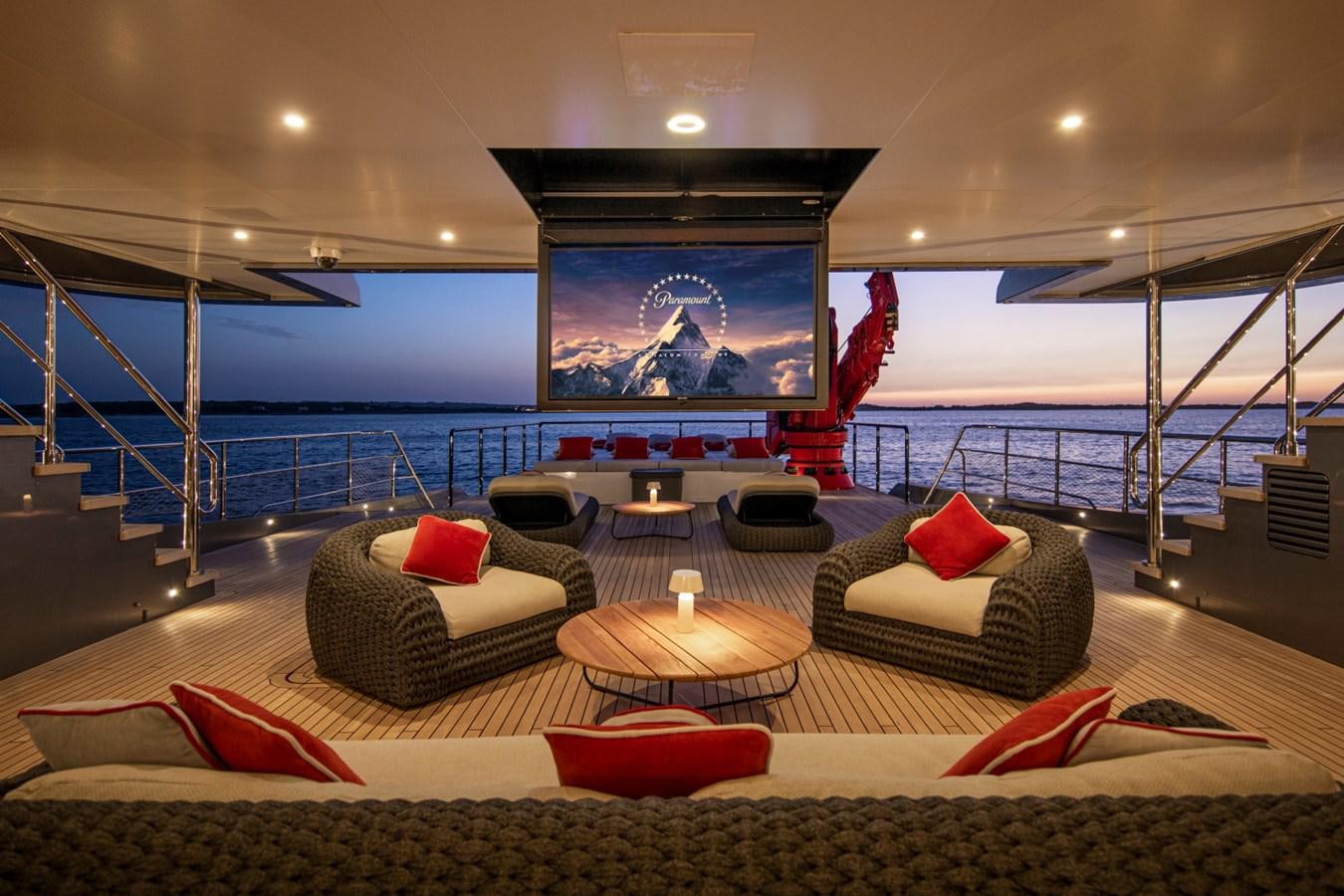 a living room with a large balcony aboard AUDACE Yacht for Sale
