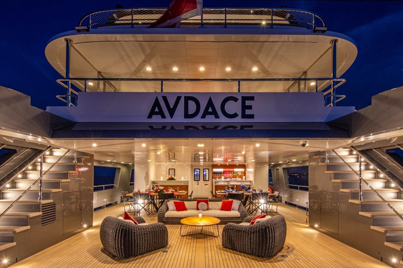 a large building with a staircase and chairs aboard AUDACE Yacht for Sale